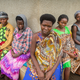 Surrounded by pregnant women and their caretakers, Jackeline Nikungu, 32, (center) waits to give birth to her fifth child.